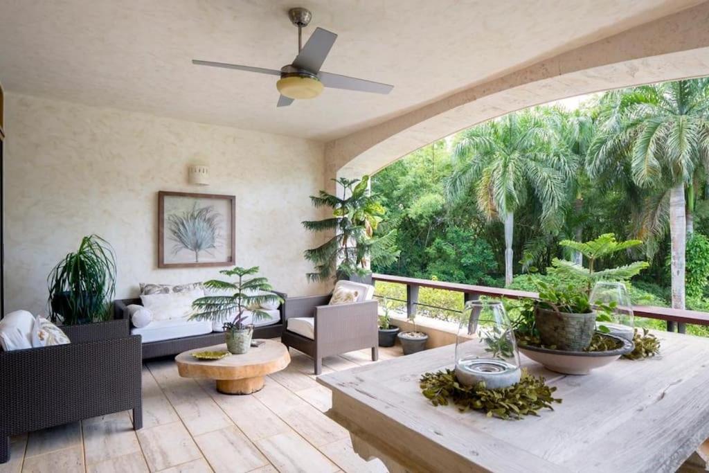 a living room with a couch and a table at Chic Luxury Condo At Los Altos Casa De Campo in La Romana