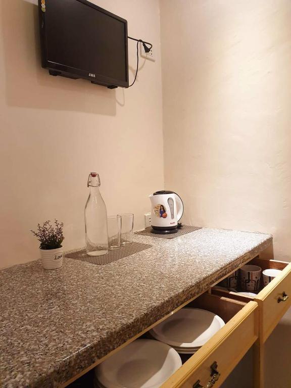 Kuchyň nebo kuchyňský kout v ubytování Palompon Sugar's Inn