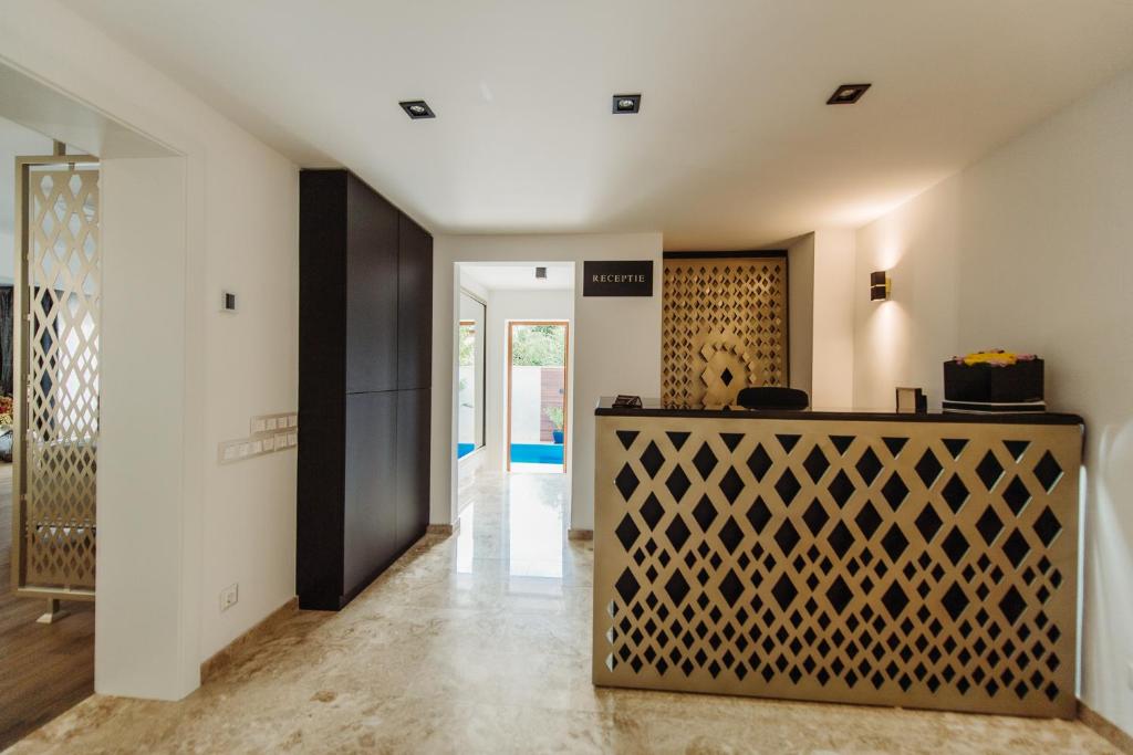 a hallway of a house with a wooden front door at Boutique Damiani in Sibiu