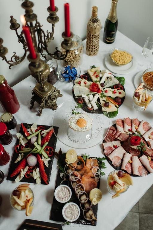 a table with many different types of food on it at Boutique Damiani in Sibiu