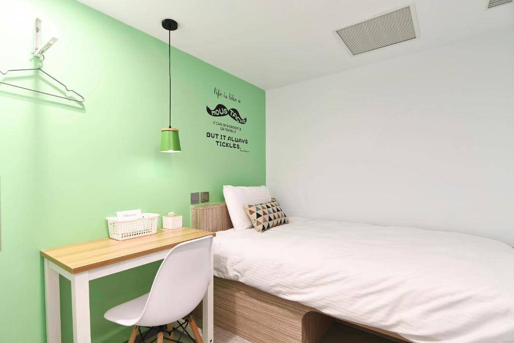 Postel nebo postele na pokoji v ubytování Flyinn Hostel
