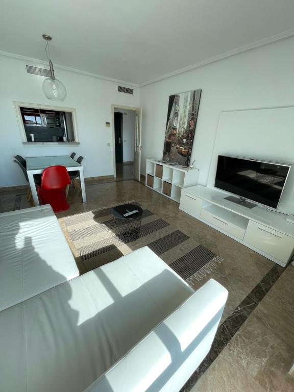 A television and/or entertainment centre at Little relax Marbella centro