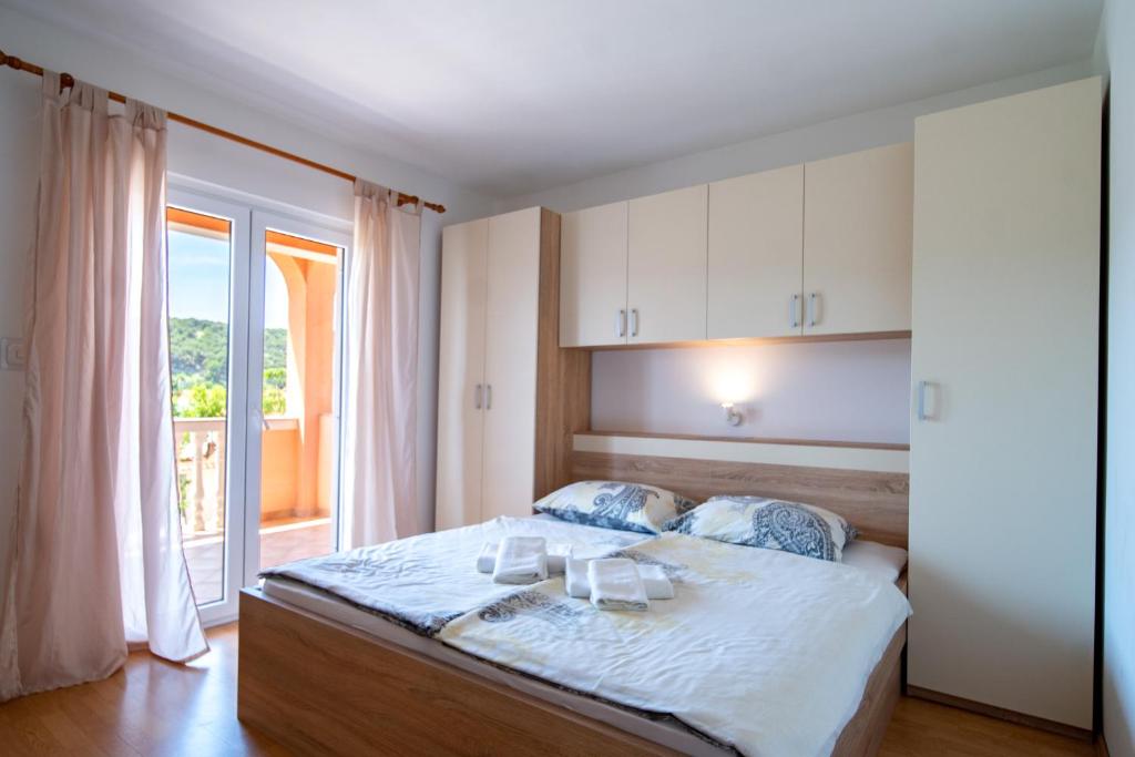 Кровать или кровати в номере Kastell Apartments
