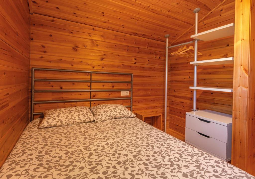 Postel nebo postele na pokoji v ubytování Cabañas El Ruso