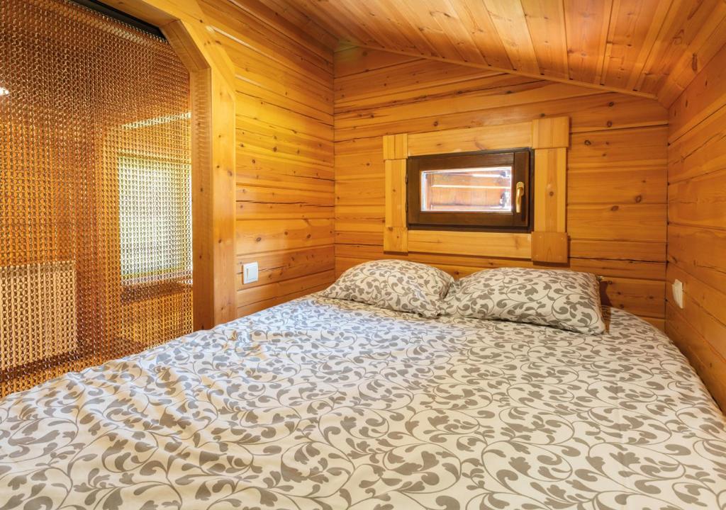 Postel nebo postele na pokoji v ubytování Cabañas El Ruso