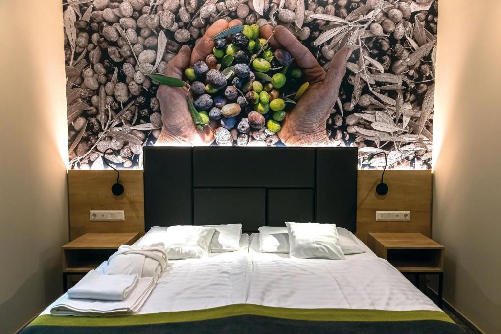 Postel nebo postele na pokoji v ubytování Oliva Hotel