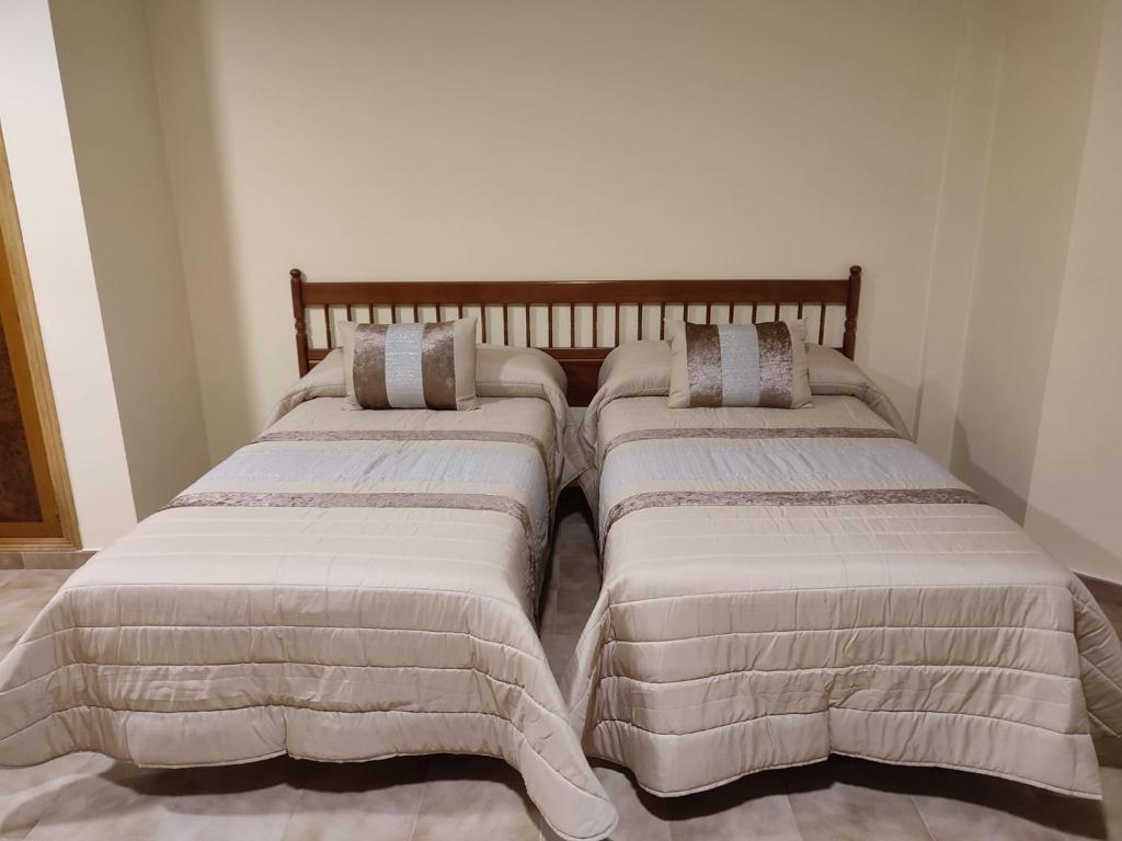 Posteľ alebo postele v izbe v ubytovaní Hotel Novo