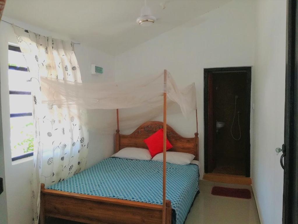 Postel nebo postele na pokoji v ubytování 20 House Arugam