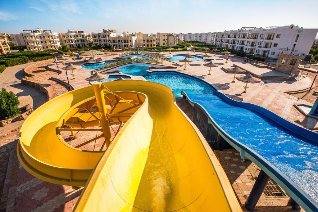 a water park with a water slide and a water slide at Golden Beach 1 Ras Sedr in Ras Sedr