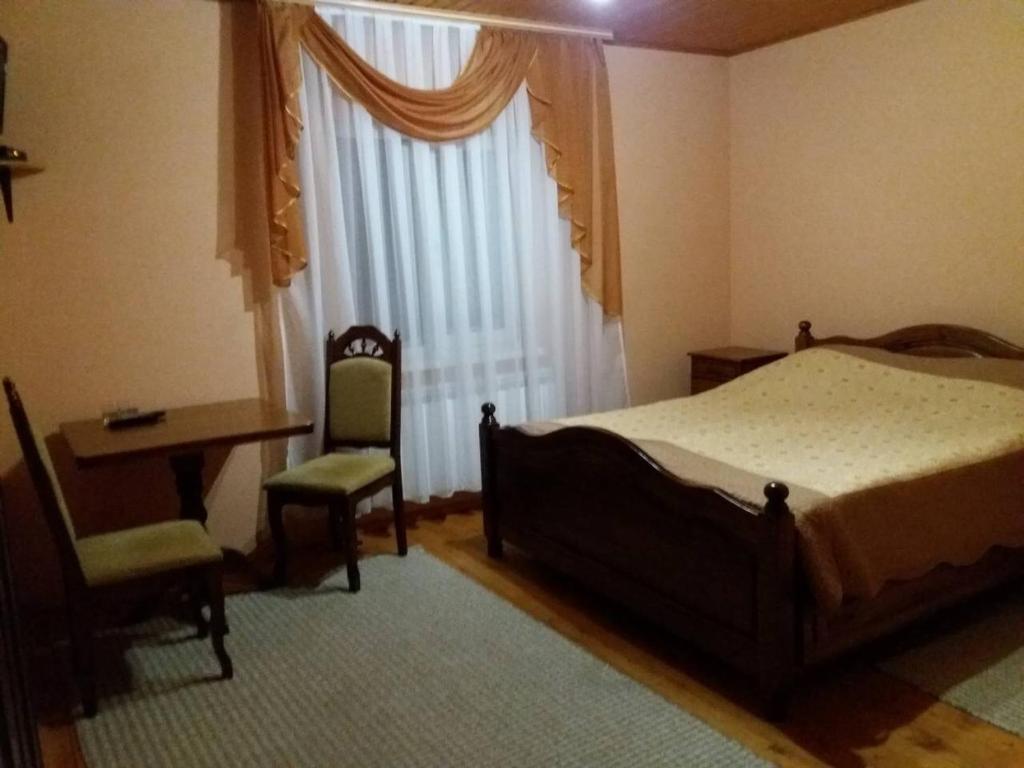 Postel nebo postele na pokoji v ubytování Горизонт