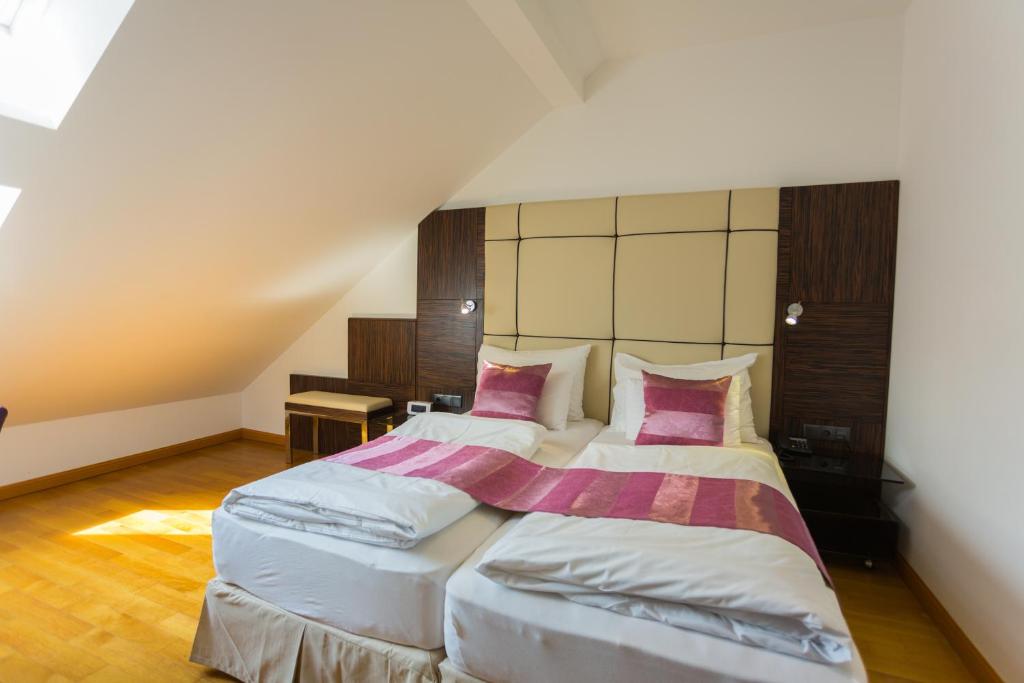 Postel nebo postele na pokoji v ubytování Best Western Plus Hotel Arcadia