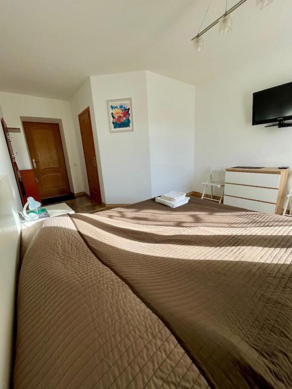 Postel nebo postele na pokoji v ubytování Yaremche House