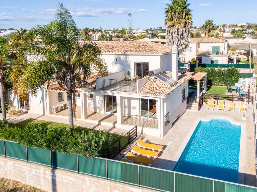 an aerial view of a house with a swimming pool at Villa Cordeiro - Heated Pool - Free wi-fi - Air Con in Guia