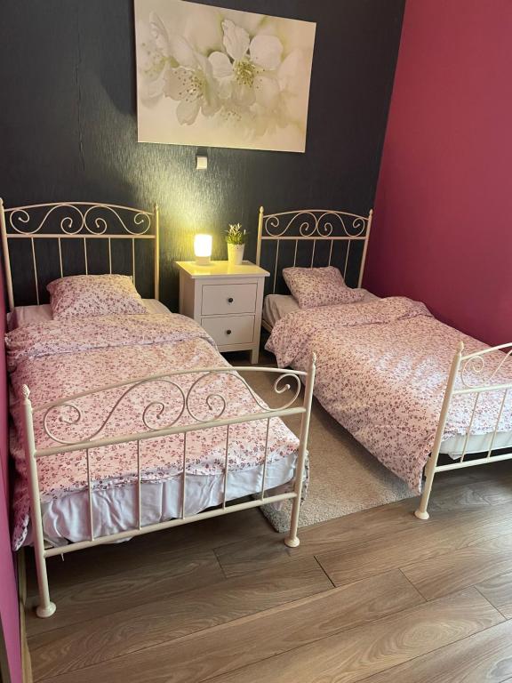 Postel nebo postele na pokoji v ubytování Apartament Janek