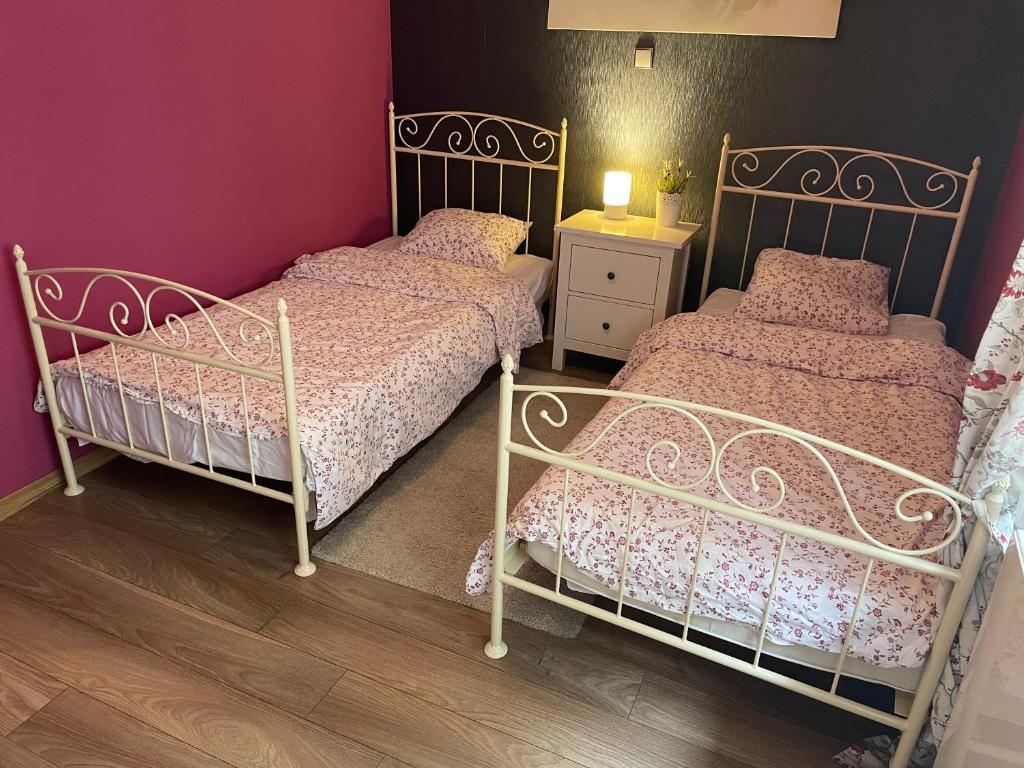 Postel nebo postele na pokoji v ubytování Apartament Janek