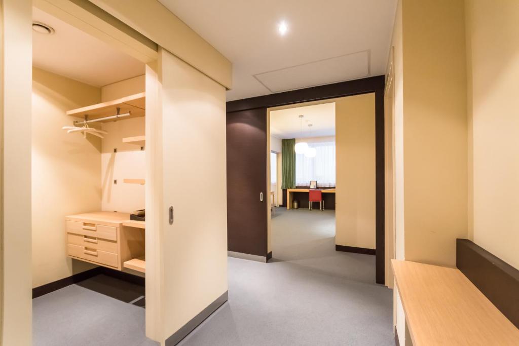 Postel nebo postele na pokoji v ubytování Mirage Hotel