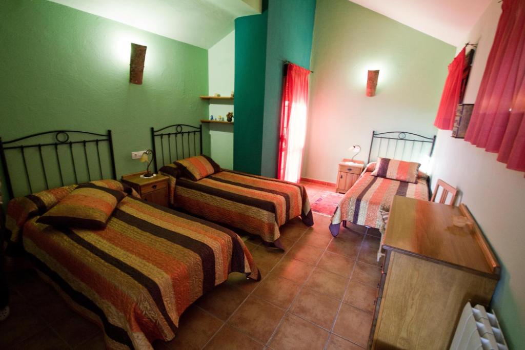 Postel nebo postele na pokoji v ubytování Hotel Rural Valle del Tuejar
