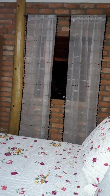 Postel nebo postele na pokoji v ubytování Casa dos Sonhos Hospedaria