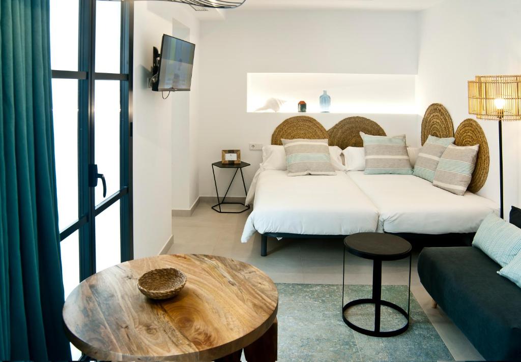 Posteľ alebo postele v izbe v ubytovaní Aparthotel El Cargol