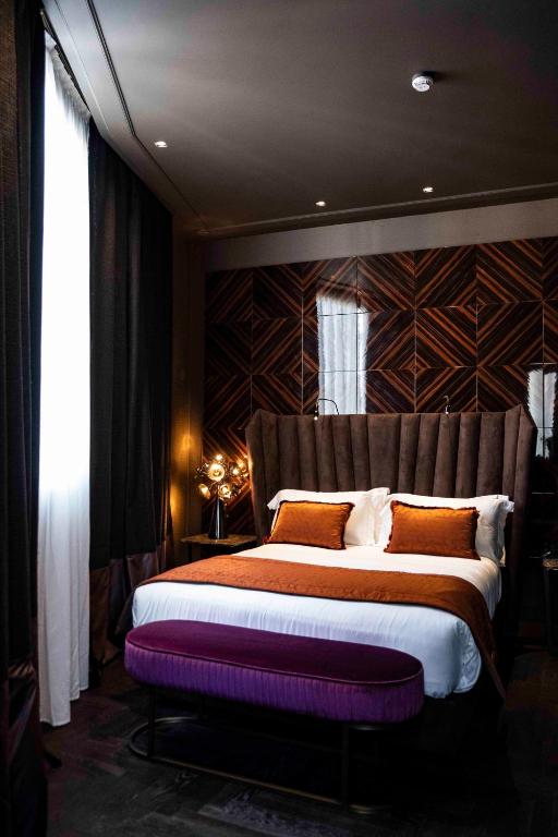 Postel nebo postele na pokoji v ubytování U-Visionary Roma Hotel