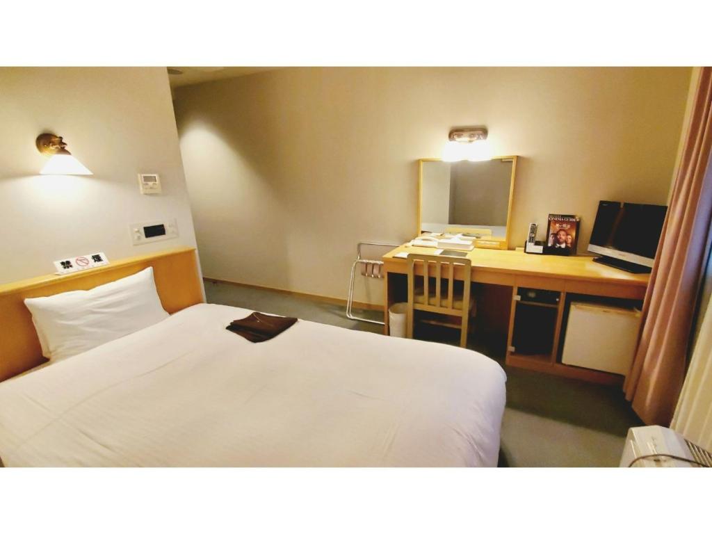 Un pat sau paturi într-o cameră la Island Hotel - Vacation STAY 76667v