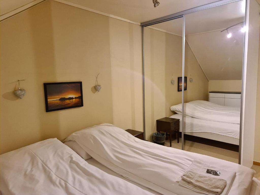 Postel nebo postele na pokoji v ubytování Skeisvang Gjestgiveri