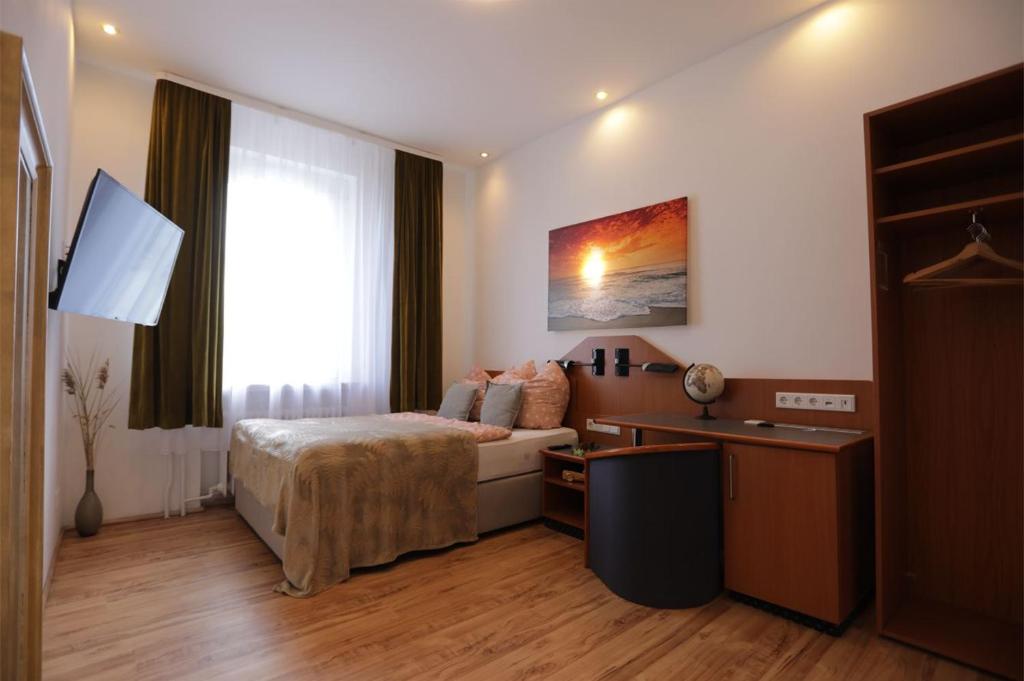 Postel nebo postele na pokoji v ubytování Star Apartments
