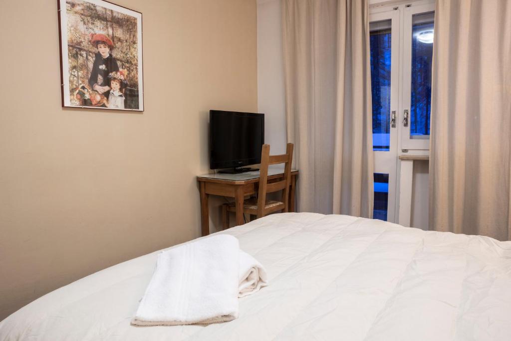 Postel nebo postele na pokoji v ubytování Hotel Hermitage