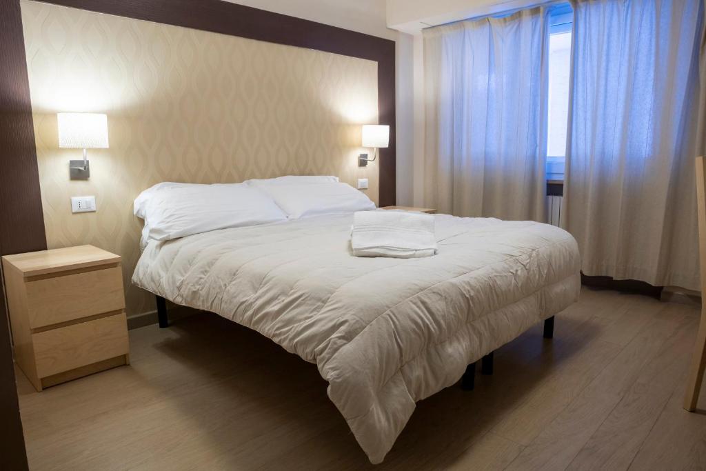Postel nebo postele na pokoji v ubytování Hotel Hermitage