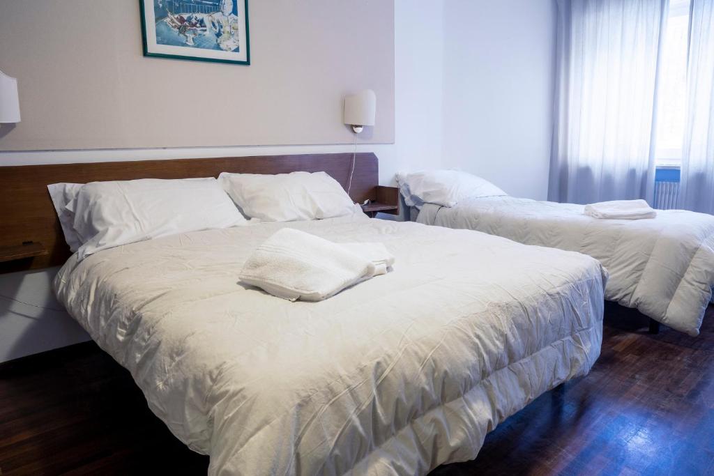 Postel nebo postele na pokoji v ubytování Hotel Hermitage