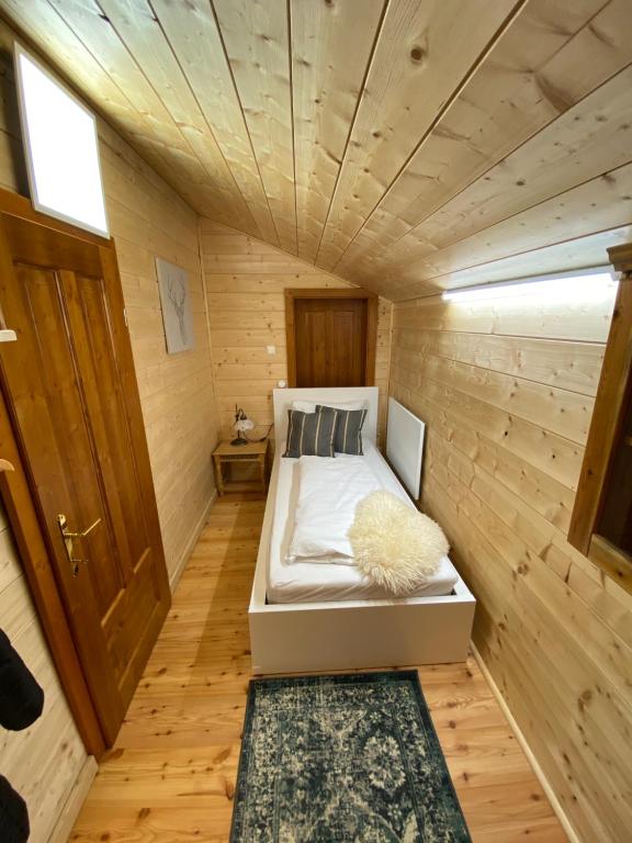 Ένα ή περισσότερα κρεβάτια σε δωμάτιο στο Chalet Obertraun