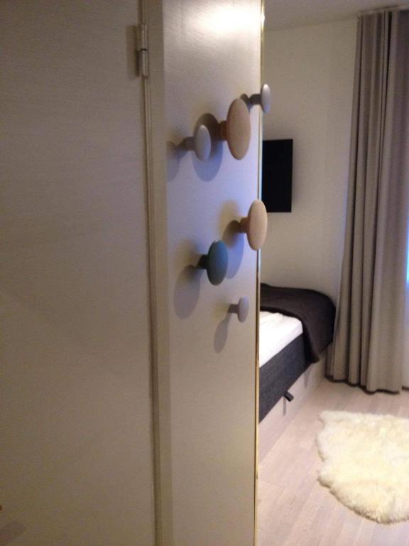 a door with some knobs on it in a room at Avanti Apartment Hotel in Stockholm