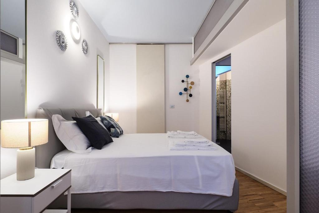 Ένα ή περισσότερα κρεβάτια σε δωμάτιο στο Mila Apartments Alessi