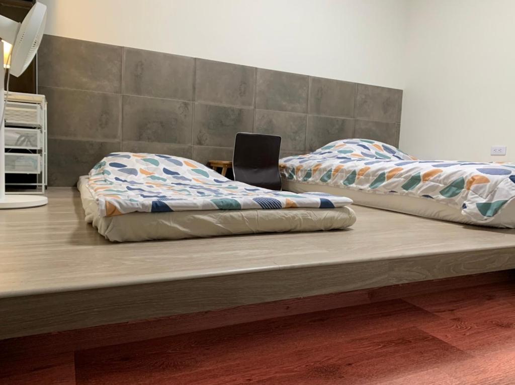Postel nebo postele na pokoji v ubytování 幸福客棧