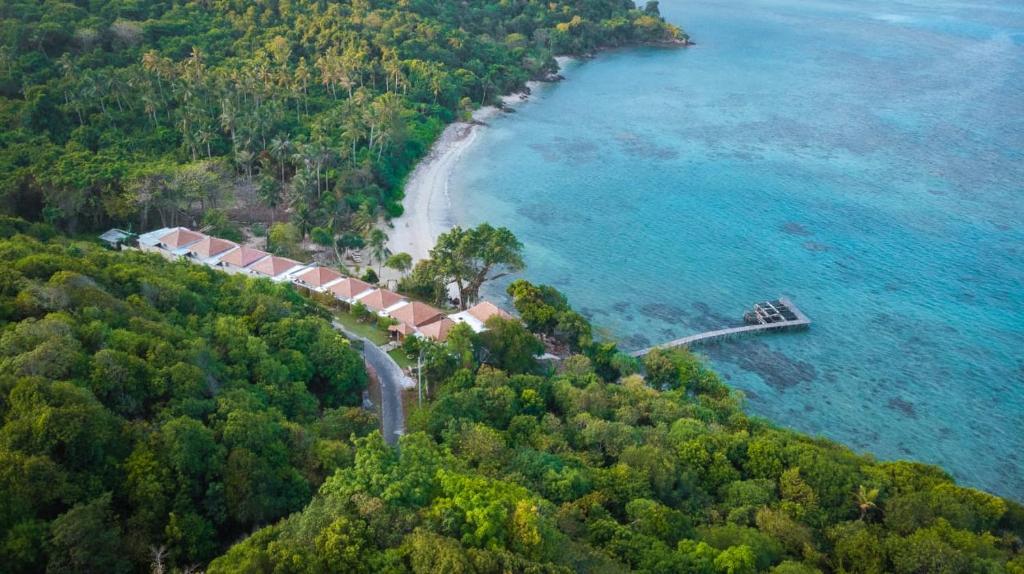 an aerial view of a house on a island in the ocean at Legon Waru Cottage in Karimunjawa