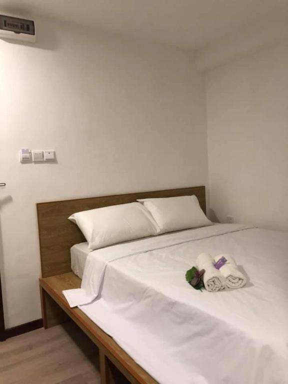 Postel nebo postele na pokoji v ubytování Kapit Hotel