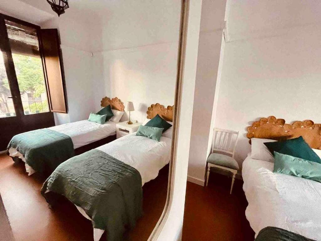 A bed or beds in a room at Apartamento Céntrico Corredera