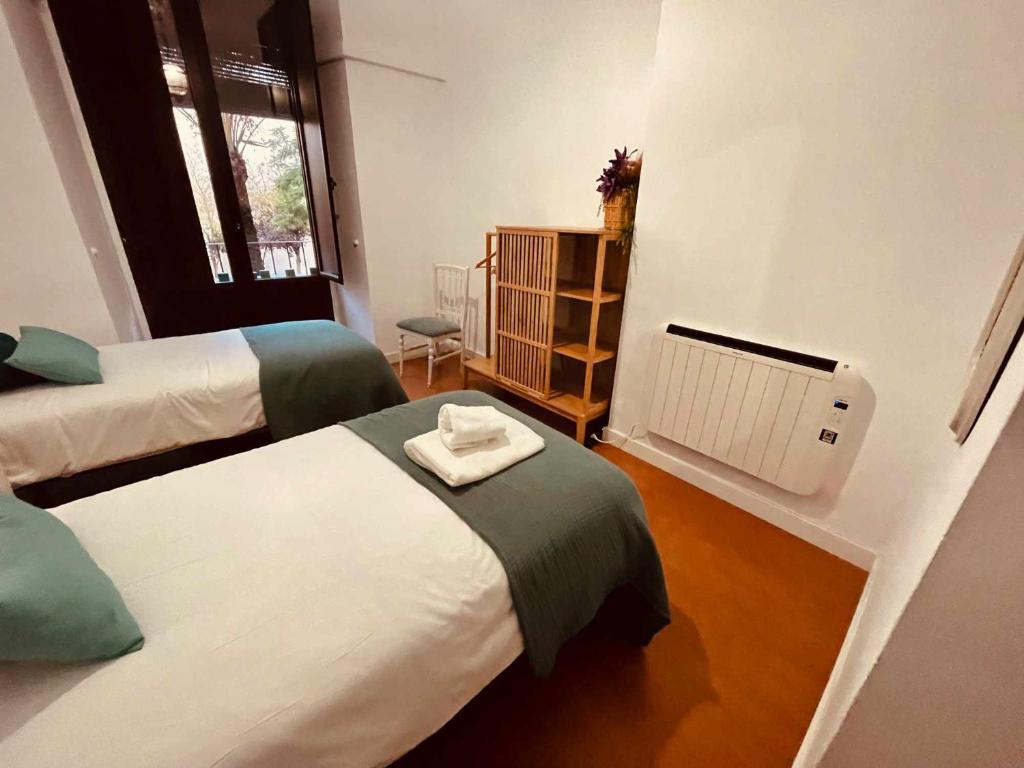 A bed or beds in a room at Apartamento Céntrico Corredera