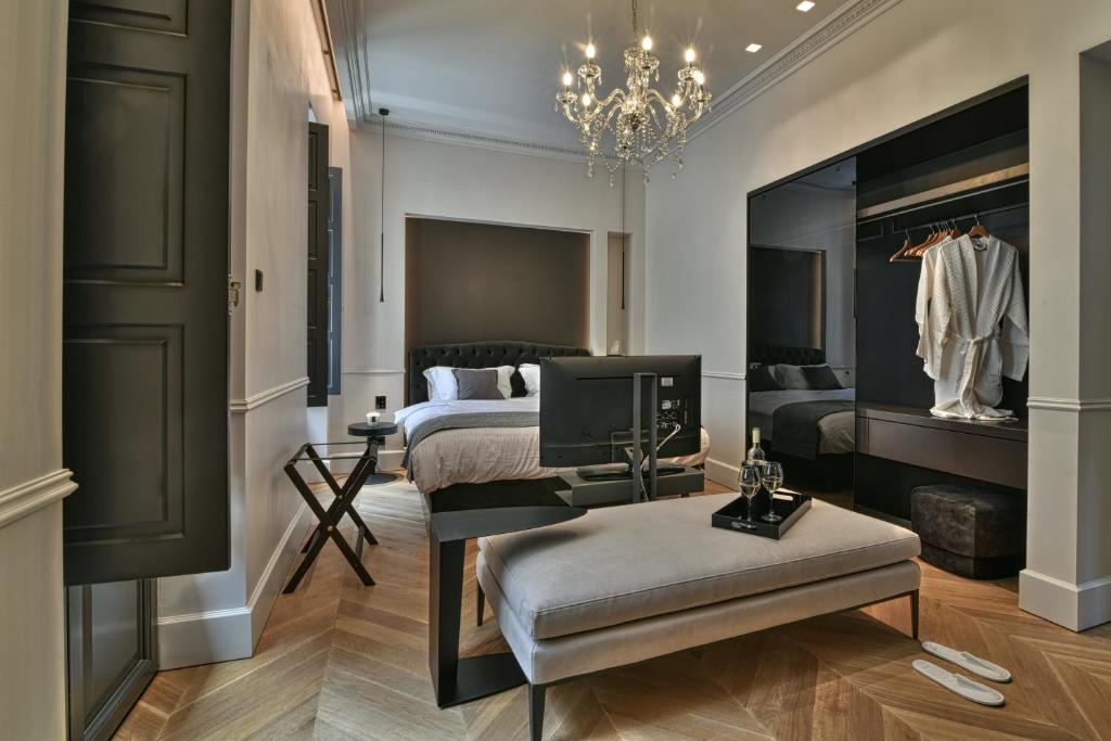 Posteľ alebo postele v izbe v ubytovaní Athens Dom Hotel