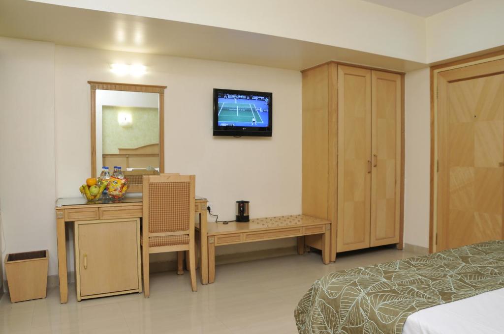 Postel nebo postele na pokoji v ubytování Hotel Abigail Regency