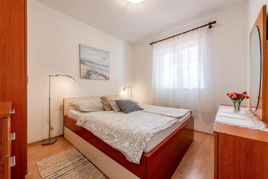 Posteľ alebo postele v izbe v ubytovaní Apartments Roje