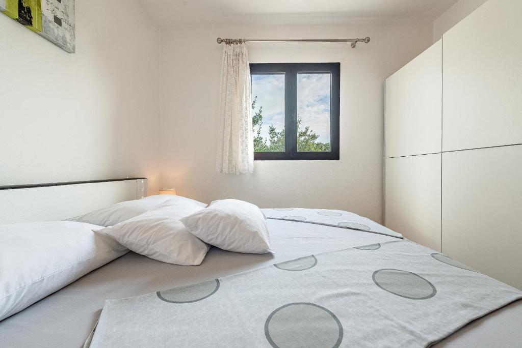 Posteľ alebo postele v izbe v ubytovaní Apartments Roje