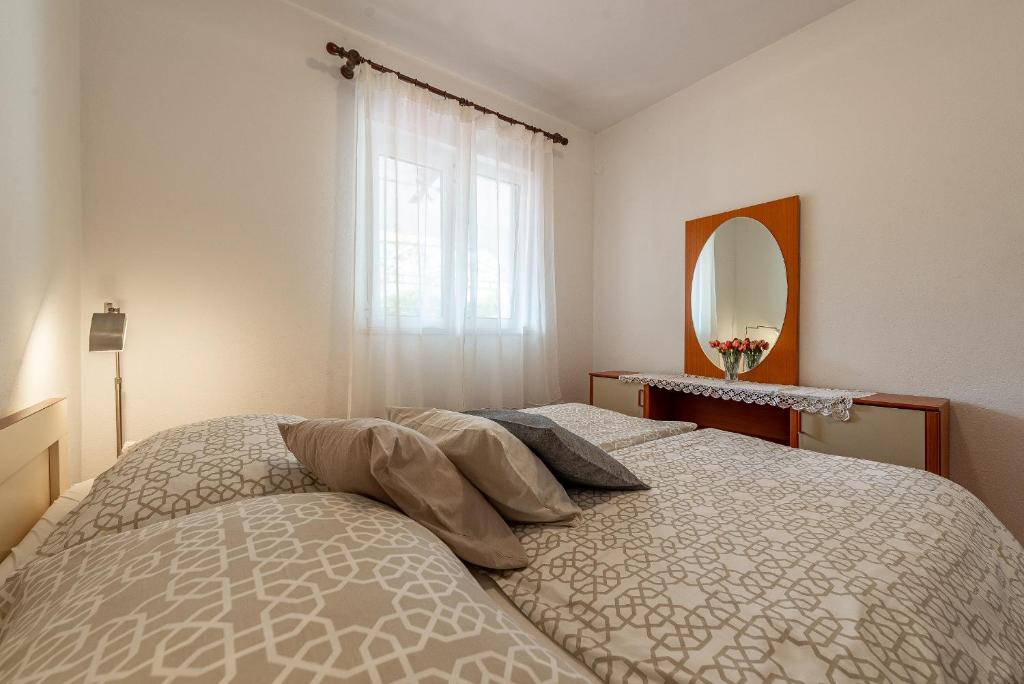 Posteľ alebo postele v izbe v ubytovaní Apartments Roje