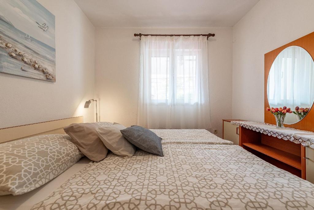 Posteľ alebo postele v izbe v ubytovaní Apartments Roje