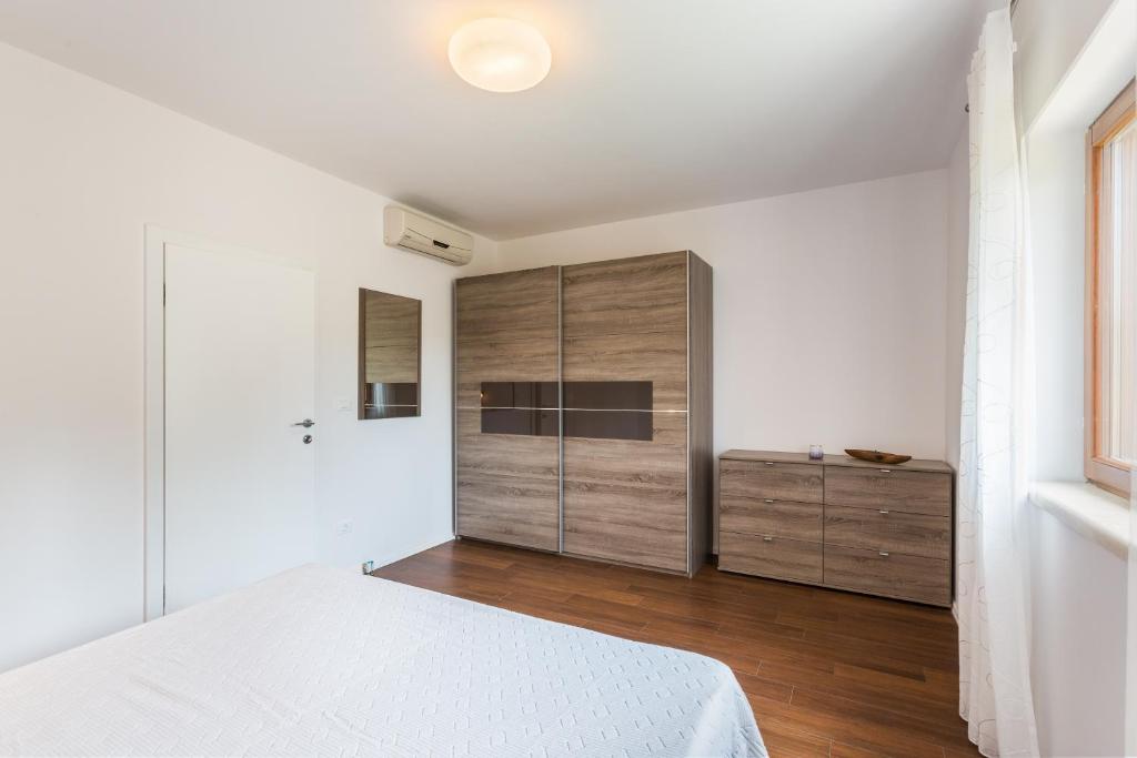 Łóżko lub łóżka w pokoju w obiekcie Villa Vignola