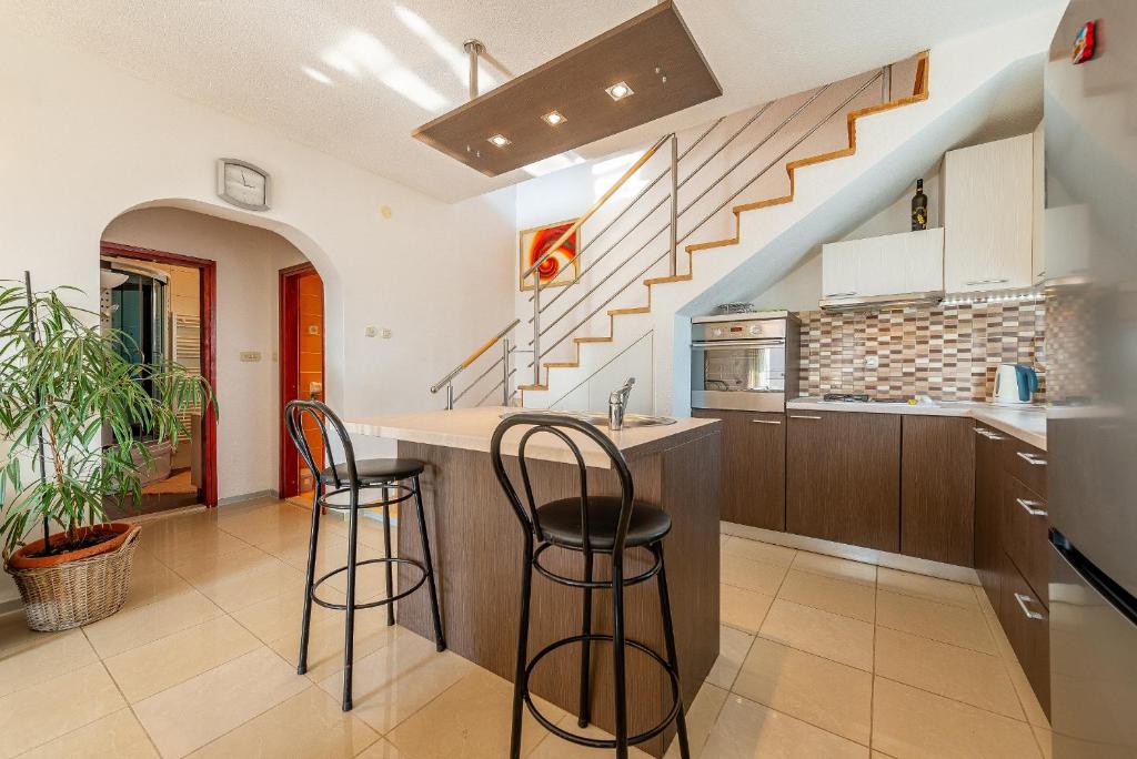 Kuchyňa alebo kuchynka v ubytovaní Apartments Roje