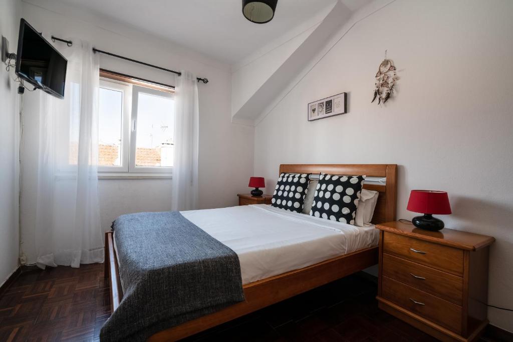 A bed or beds in a room at Casa Estrela do Mar