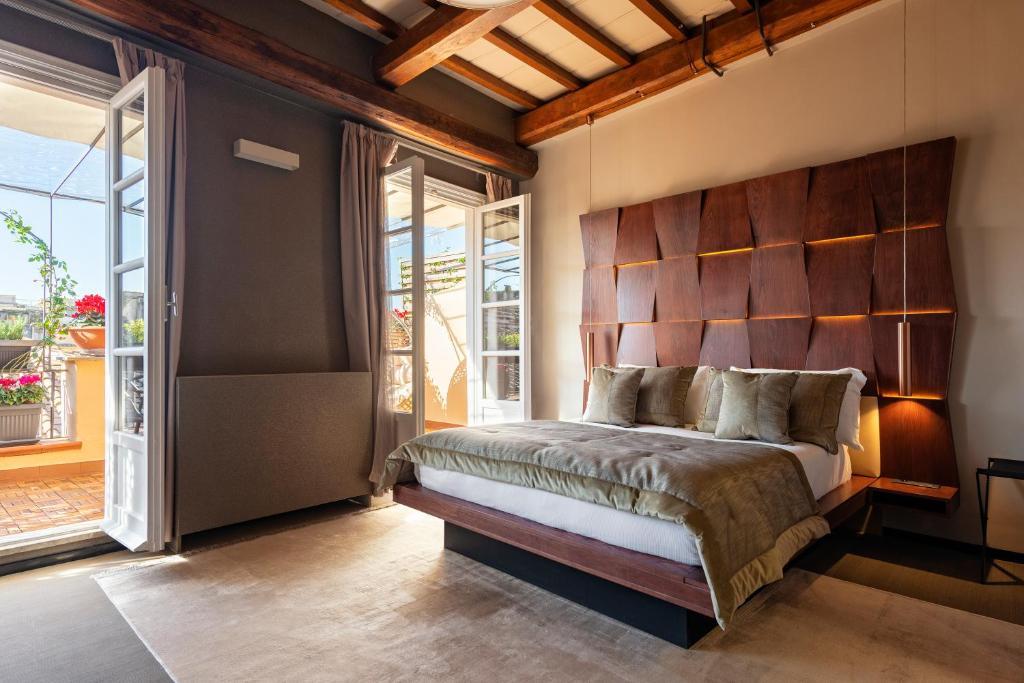 A bed or beds in a room at Ara di Marte Suites