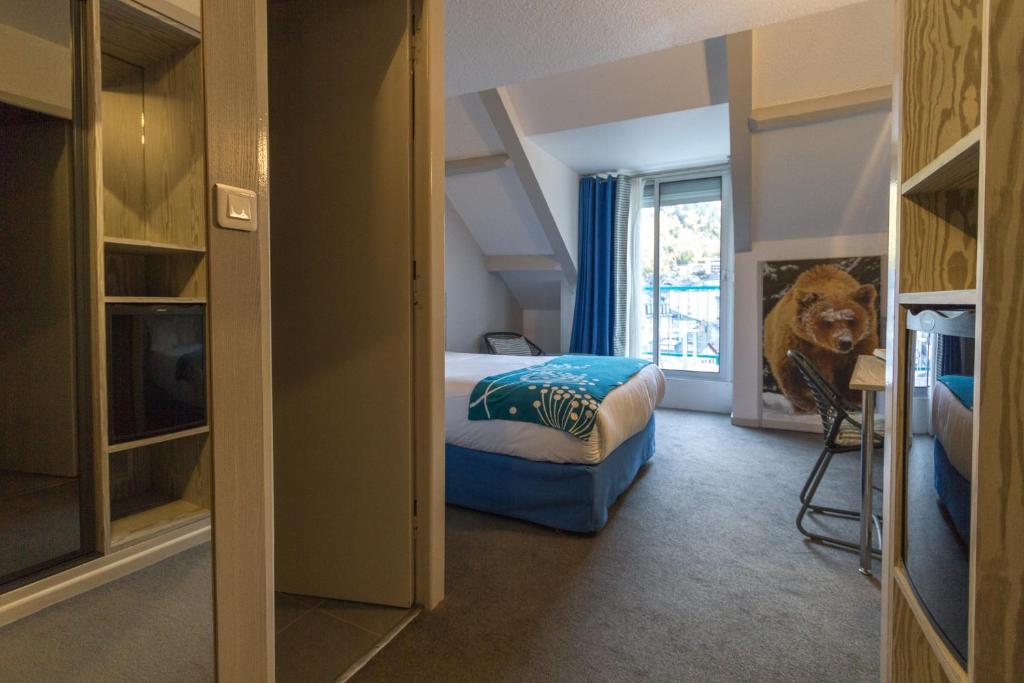 Postel nebo postele na pokoji v ubytování Hôtel-Résidence Le Lys