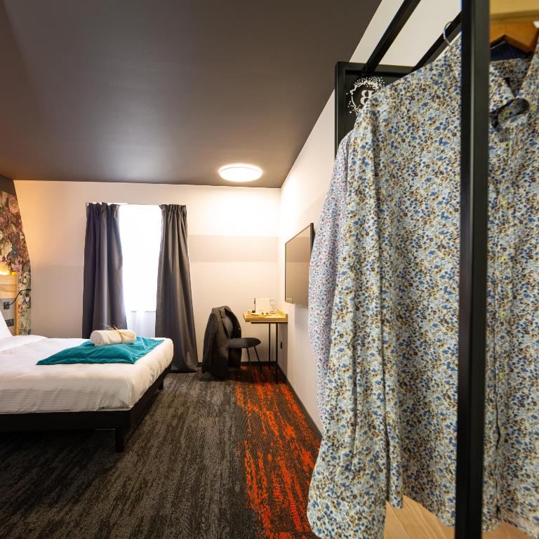 Postel nebo postele na pokoji v ubytování Berti Hotel - Mulhouse Centre Gare